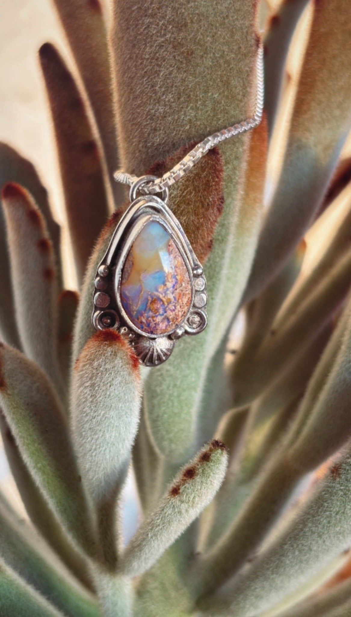 Handmade silver opal pendant on cactus